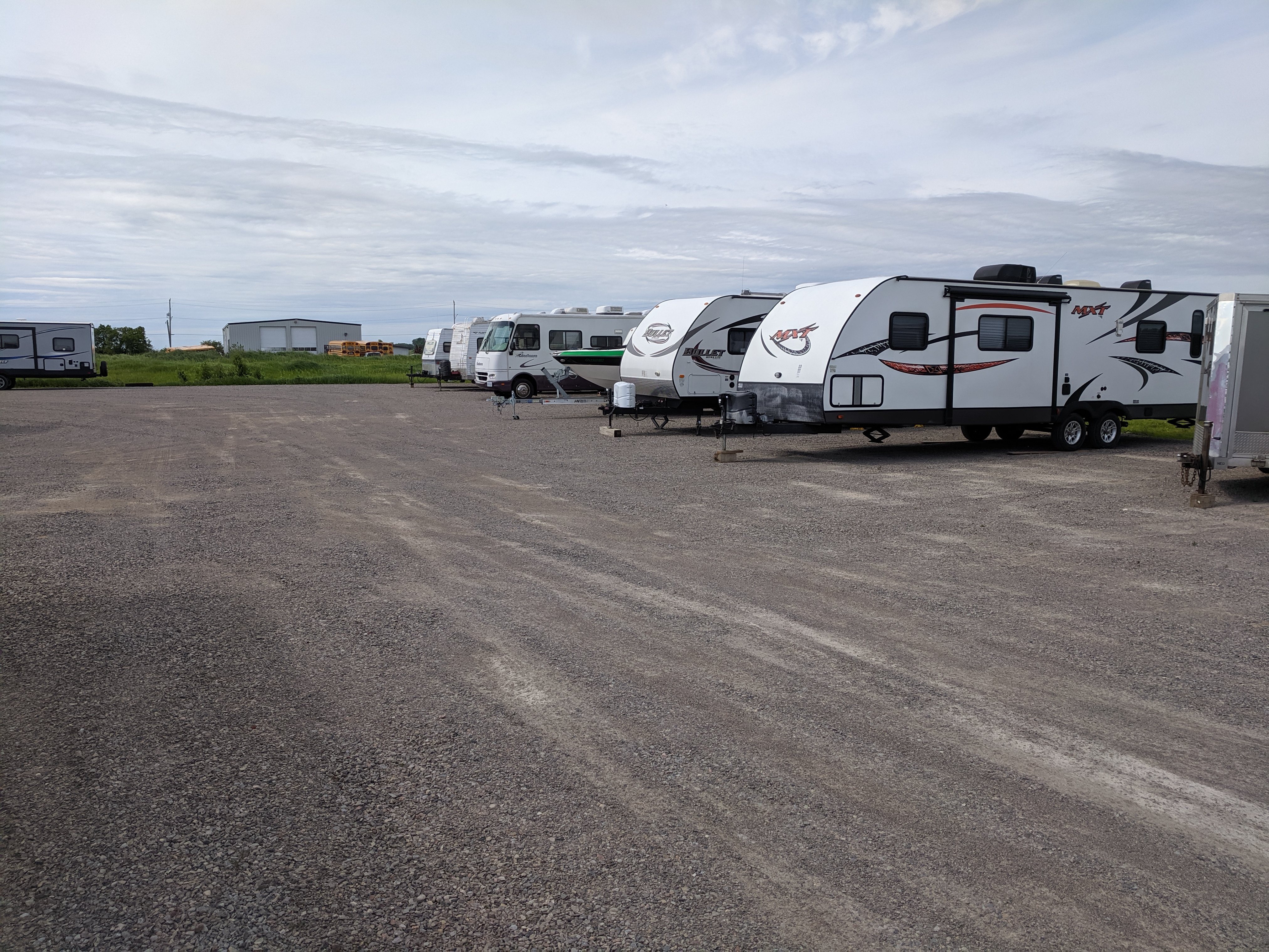 Outdoor parking area with trailers at Cavaliere Mini Storage